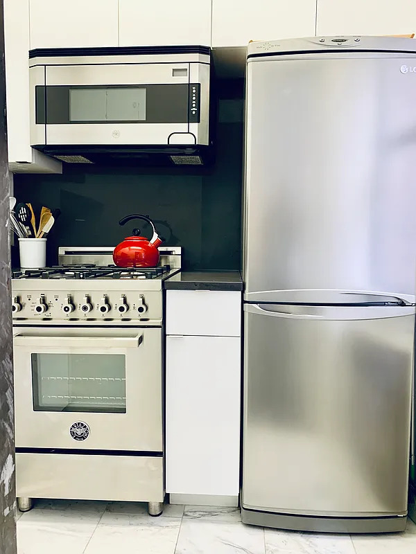 240 East 46th Street, #5A &mdash; Windowed kitchen with the Bertazzoni gas range