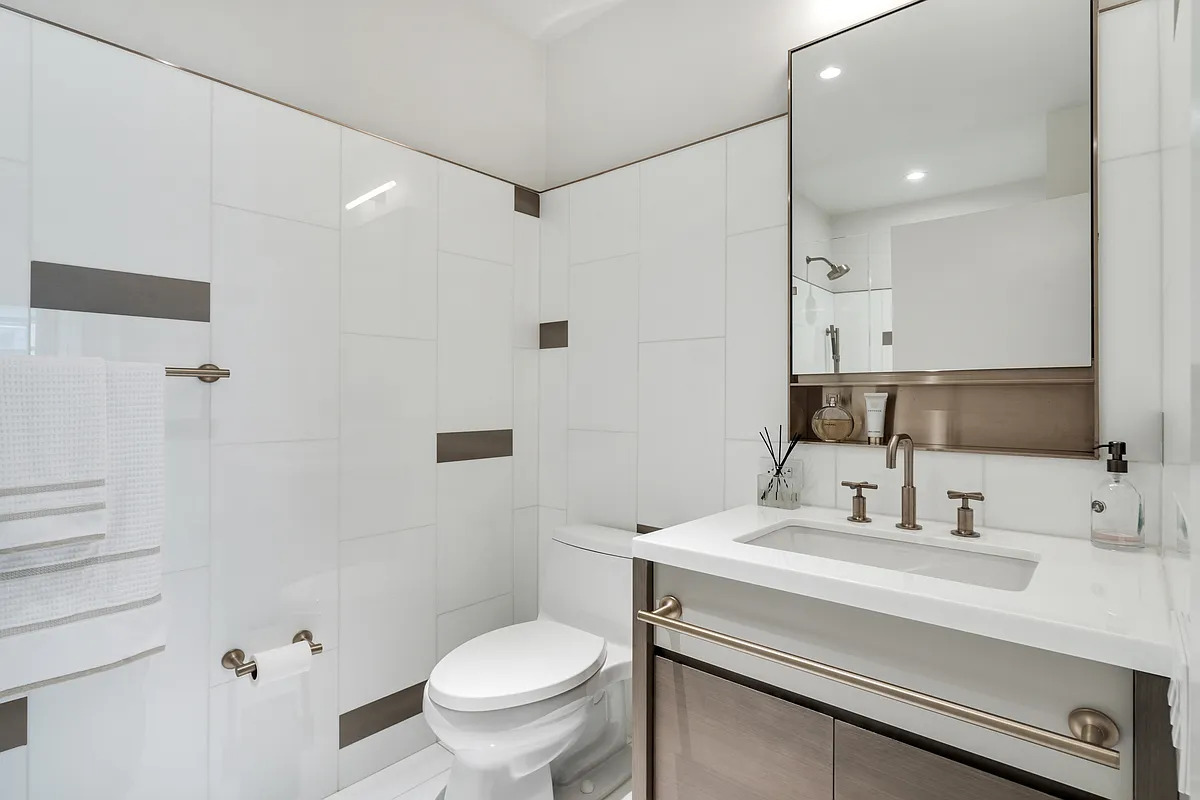 305 East 51st Street, #4H &mdash; Second full bath in marble with a glass-enclosed shower